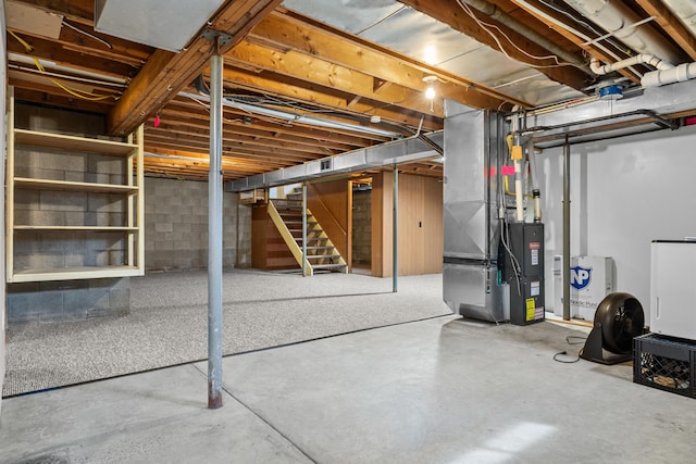 unfinished basement with stairway and heating unit