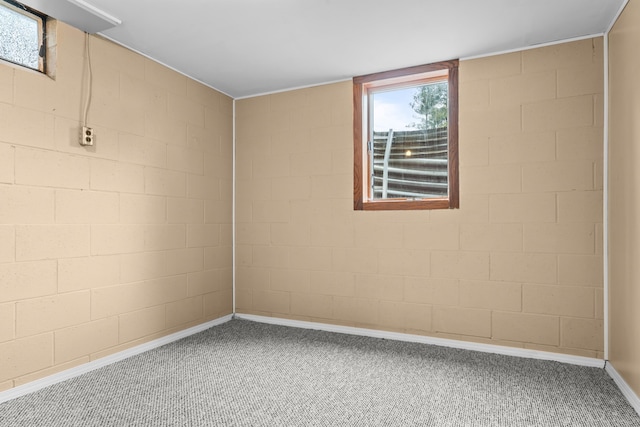 carpeted empty room with baseboards
