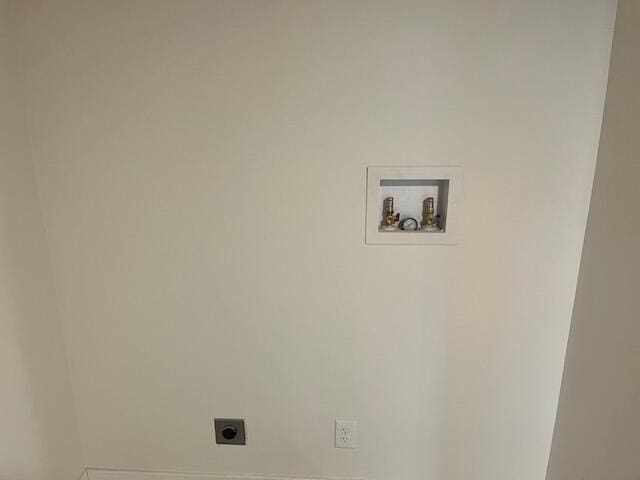 clothes washing area with washer hookup, laundry area, and hookup for an electric dryer