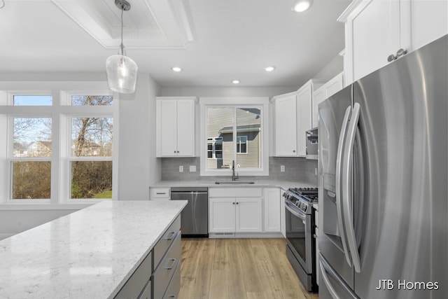 7571 Brook Villa Ct, Allendale, MI 49401 - kitchen with appliances with stainless steel finishes, tasteful backsplash, light stone counters, recessed lighting, and white cabinets