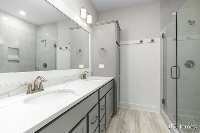 7571 Brook Villa Ct, Allendale, MI 49401 - full bathroom with double vanity and a stall shower