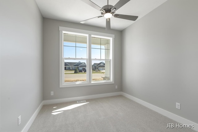 7571 Brook Villa Ct, Allendale, MI 49401 - carpeted spare room featuring baseboards and ceiling fan