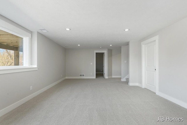 7571 Brook Villa Ct, Allendale, MI 49401 - spare room with light carpet, recessed lighting, baseboards, and stairs