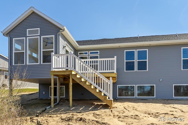 7571 Brook Villa Ct, Allendale, MI 49401 - rear view of house featuring a deck, stairway, and a sunroom