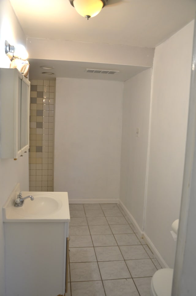 bathroom with visible vents, tile patterned floors, vanity, and toilet
