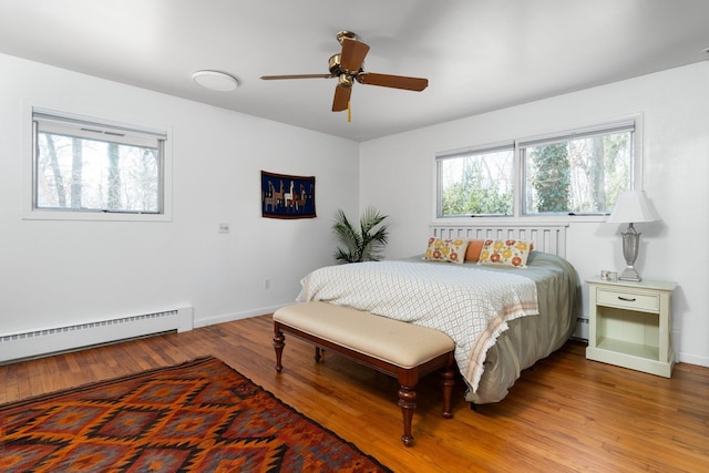 1657 Glenwood Rd, Ann Arbor, MI 48104 - bedroom featuring multiple windows, wood finished floors, and baseboards