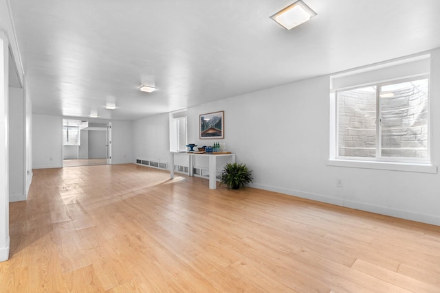 1657 Glenwood Rd, Ann Arbor, MI 48104 - unfurnished living room with light wood-type flooring and baseboards