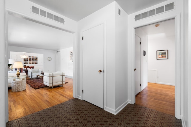 1657 Glenwood Rd, Ann Arbor, MI 48104 - hallway featuring baseboards and wood finished floors