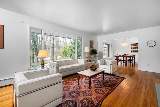 1657 Glenwood Rd, Ann Arbor, MI 48104 - living room with hardwood / wood-style floors, baseboards, and a baseboard heating unit