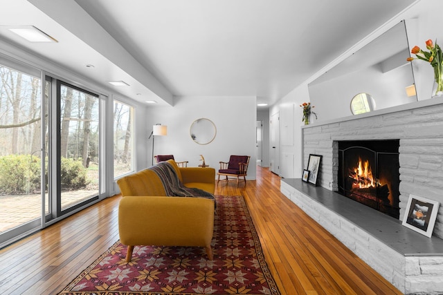 1657 Glenwood Rd, Ann Arbor, MI 48104 - living room featuring wood-type flooring and a fireplace