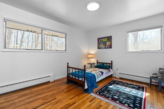 1657 Glenwood Rd, Ann Arbor, MI 48104 - bedroom with baseboard heating and wood finished floors