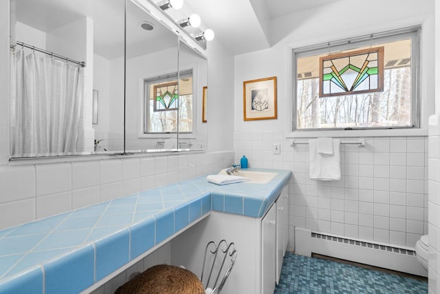 1657 Glenwood Rd, Ann Arbor, MI 48104 - bathroom with a baseboard radiator and vanity