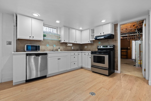 1657 Glenwood Rd, Ann Arbor, MI 48104 - kitchen featuring stainless steel appliances, under cabinet range hood, water heater, light wood-type flooring, and open shelves