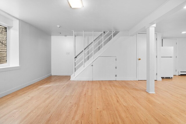 1657 Glenwood Rd, Ann Arbor, MI 48104 - finished basement featuring freestanding refrigerator, wood finished floors, baseboards, and stairway