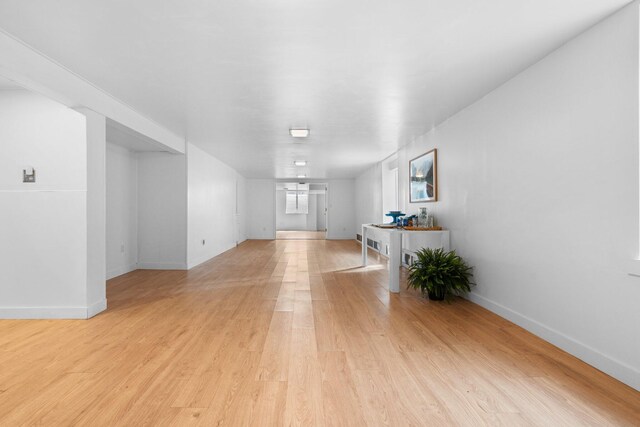 1657 Glenwood Rd, Ann Arbor, MI 48104 - unfurnished living room featuring light wood-style flooring and baseboards