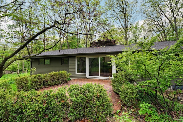 1657 Glenwood Rd, Ann Arbor, MI 48104 - rear view of house featuring a chimney