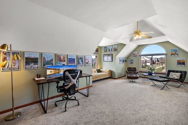 carpeted office featuring lofted ceiling, baseboards, and ceiling fan