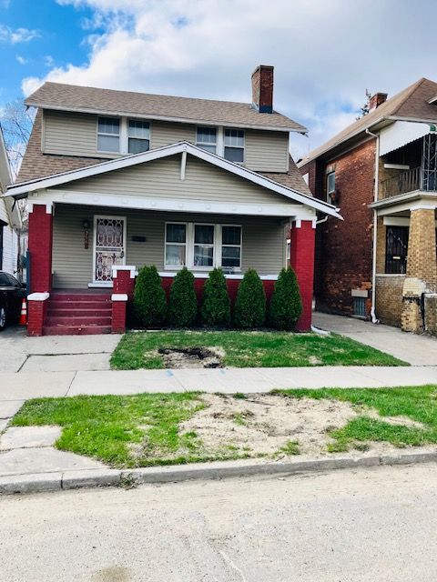 2961 Montgomery St, Detroit, MI 48206 - view of front facade featuring a shingled roof, a chimney, and covered porch