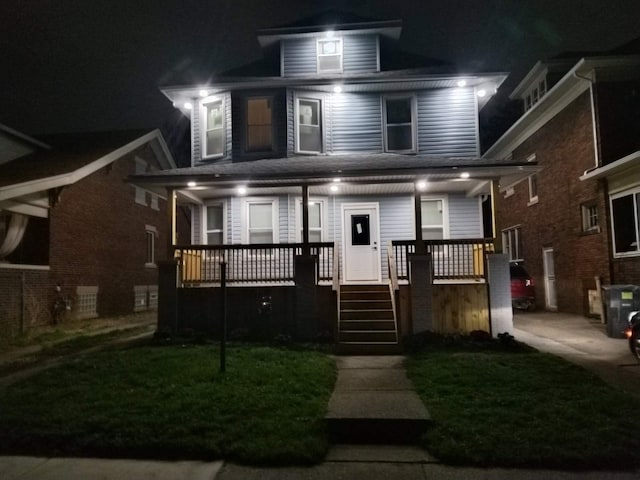 4411 Iroquois St, Detroit, MI 48214 - view of front of property featuring a lawn and a porch
