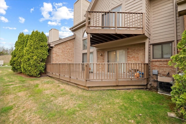 26765 Plumgrove Ln, Farmington Hills, MI 48334 - back of property featuring brick siding, a yard, a chimney, and a balcony