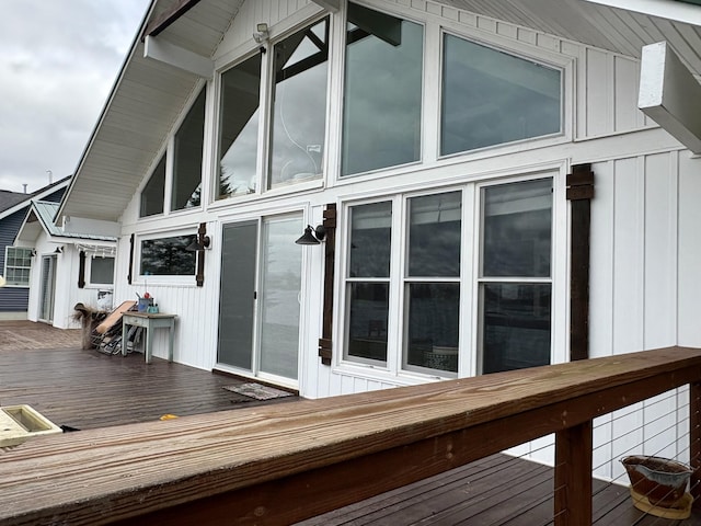 17570 Apache Trl, Howard City, MI 49329 - view of home's exterior with a wooden deck and board and batten siding