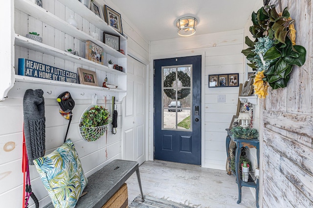 17570 Apache Trl, Howard City, MI 49329 - mudroom with wooden walls and wood finished floors