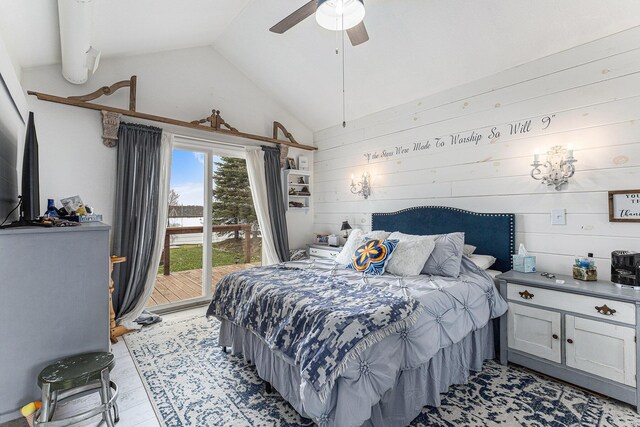 17570 Apache Trl, Howard City, MI 49329 - bedroom with wooden walls, vaulted ceiling, access to exterior, and a ceiling fan