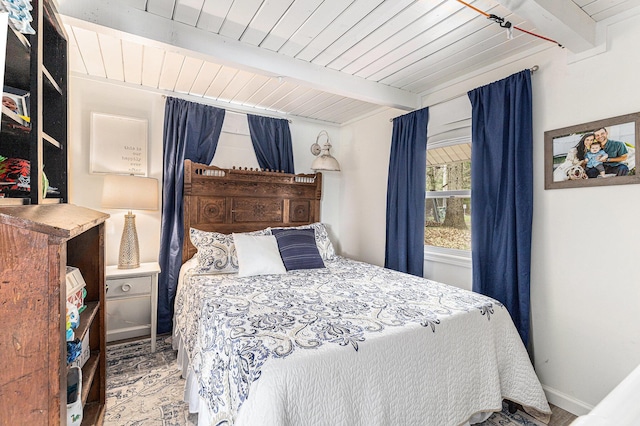 17570 Apache Trl, Howard City, MI 49329 - bedroom featuring wooden ceiling, baseboards, and beam ceiling
