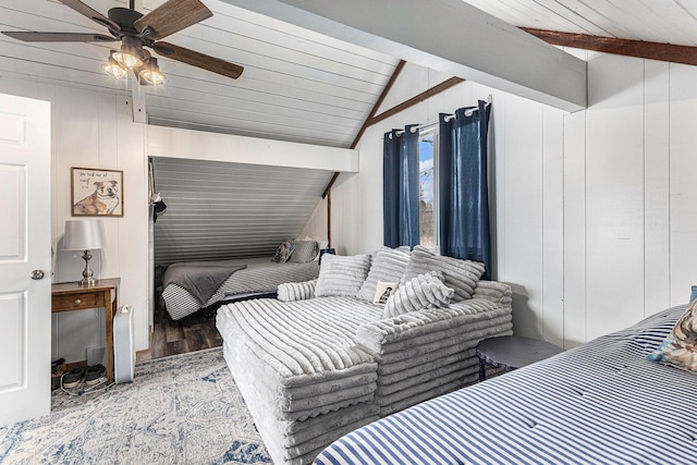 17570 Apache Trl, Howard City, MI 49329 - bedroom with wood walls, vaulted ceiling with beams, wood finished floors, and a ceiling fan