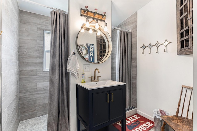 17570 Apache Trl, Howard City, MI 49329 - full bathroom featuring baseboards, vanity, and tiled shower