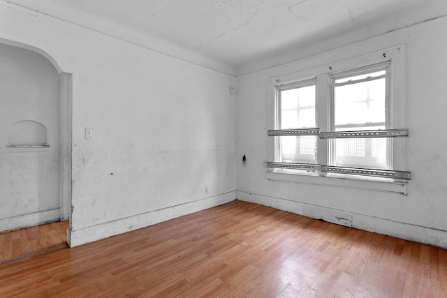 14919 Lesure St, Detroit, MI 48227 - unfurnished room with arched walkways and light wood finished floors