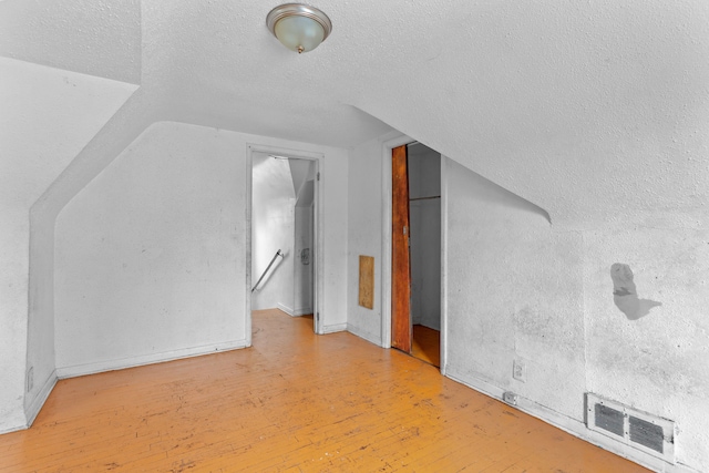14919 Lesure St, Detroit, MI 48227 - bonus room featuring wood-type flooring, a textured ceiling, and lofted ceiling