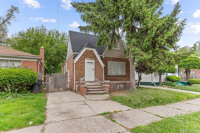 14919 Lesure St, Detroit, MI 48227 - tudor-style house featuring brick siding and roof with shingles
