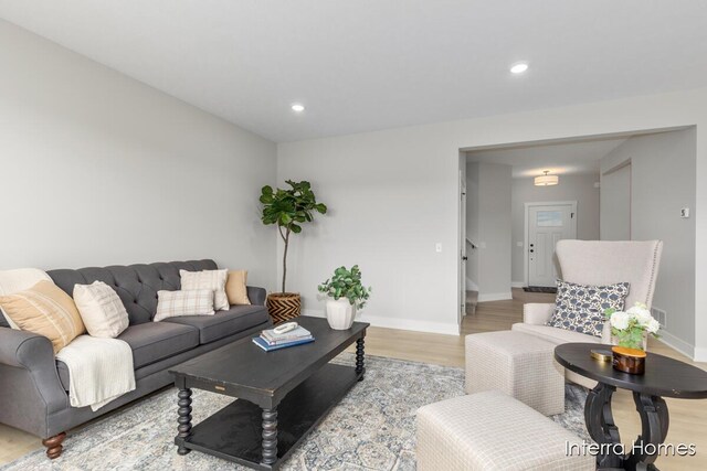 15748 Norwalk Rd, Grand Haven, MI 49417 - living room featuring wood finished floors, baseboards, and recessed lighting