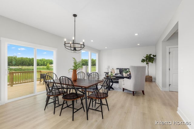 15748 Norwalk Rd, Grand Haven, MI 49417 - dining space with light wood-type flooring, a chandelier, baseboards, and recessed lighting