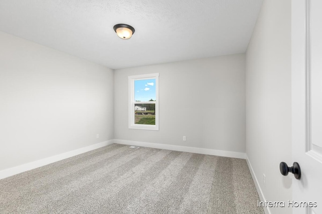 15748 Norwalk Rd, Grand Haven, MI 49417 - carpeted spare room featuring baseboards