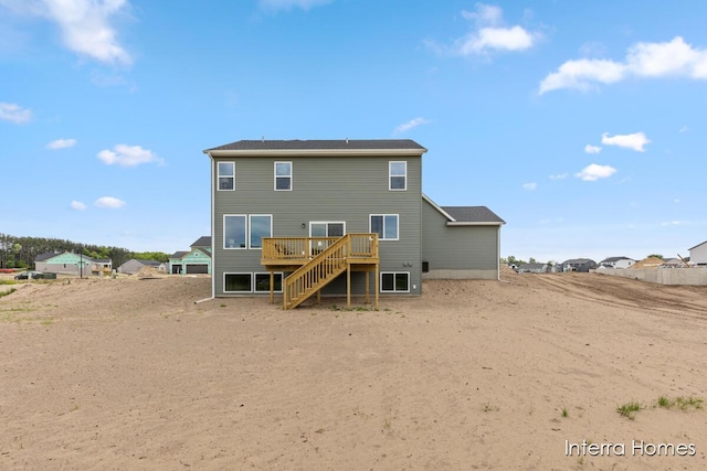 15748 Norwalk Rd, Grand Haven, MI 49417 - rear view of house featuring a deck and stairway