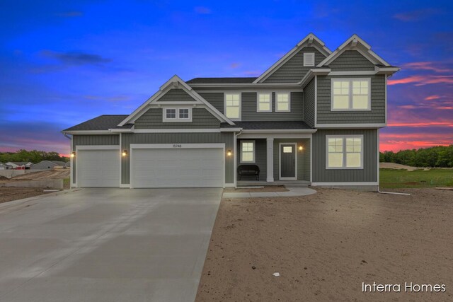 15748 Norwalk Rd, Grand Haven, MI 49417 - view of front facade with concrete driveway, an attached garage, board and batten siding, and a porch
