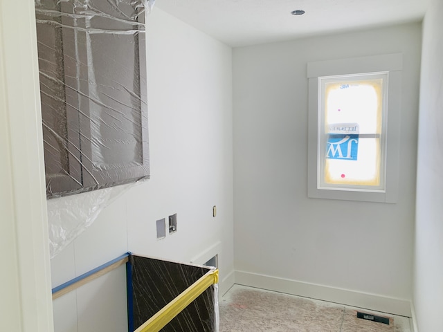 interior space featuring baseboards