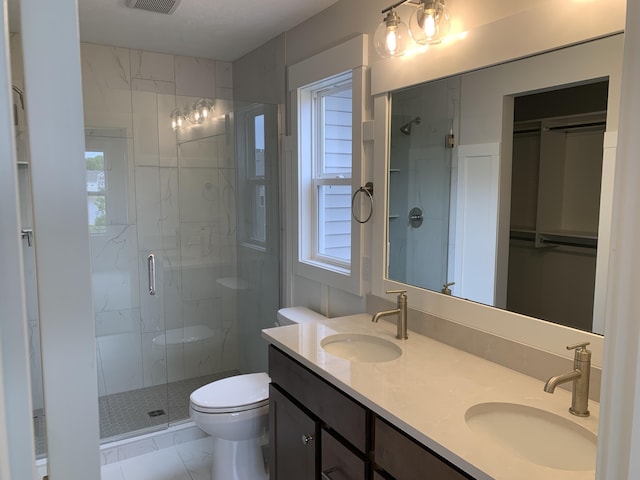 12580 Riverton Rd, Grand Haven, MI 49417 - full bath with a shower stall, double vanity, and a spacious closet