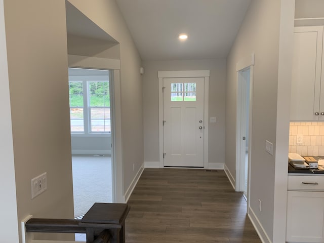 12580 Riverton Rd, Grand Haven, MI 49417 - entrance foyer featuring dark wood-type flooring, recessed lighting, and vaulted ceiling