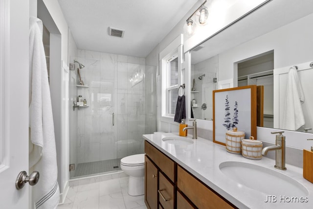 12580 Riverton Rd, Grand Haven, MI 49417 - bathroom with marble look tile flooring, a shower stall, and double vanity