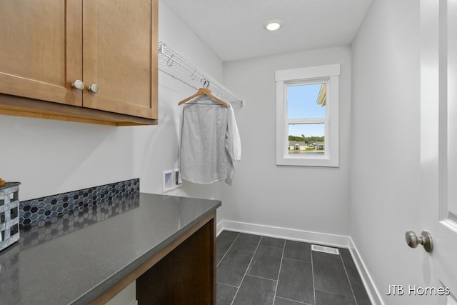 12580 Riverton Rd, Grand Haven, MI 49417 - laundry room featuring cabinet space, dark tile patterned floors, hookup for a washing machine, and recessed lighting