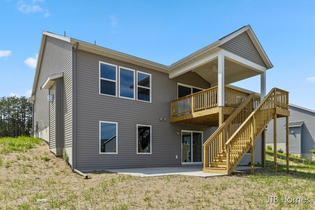 12580 Riverton Rd, Grand Haven, MI 49417 - back of house with a ceiling fan, a patio, a deck, and stairway