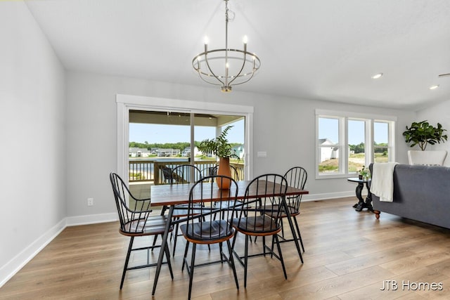 12580 Riverton Rd, Grand Haven, MI 49417 - dining space with a chandelier, wood finished floors, and recessed lighting