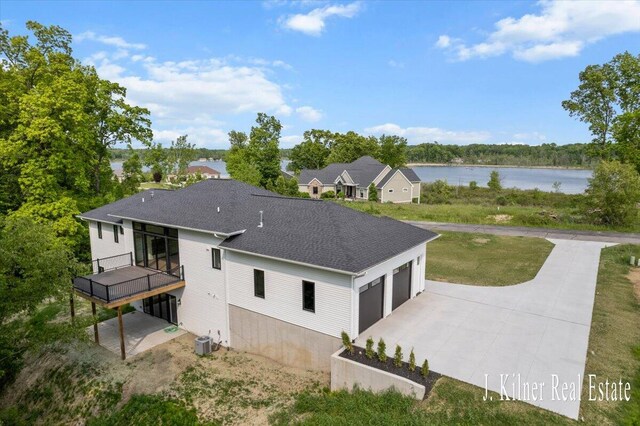 9465 Wabasis Pointe Dr NE, Greenville, MI 48838 - aerial view of property and surrounding area featuring a large body of water