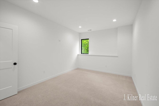 9465 Wabasis Pointe Dr NE, Greenville, MI 48838 - empty room featuring recessed lighting, carpet flooring, and baseboards