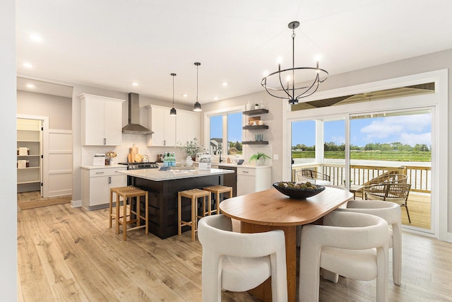 10495 Poppy Ln, Allendale, MI 49401 - dining space with a chandelier, recessed lighting, and light wood-style floors