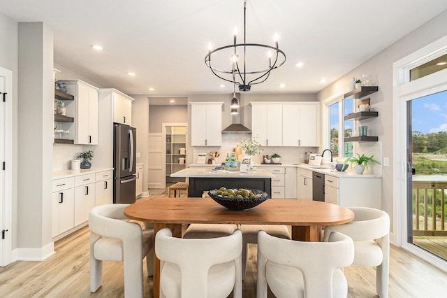 10495 Poppy Ln, Allendale, MI 49401 - kitchen featuring open shelves, wall chimney range hood, stainless steel appliances, a sink, and recessed lighting