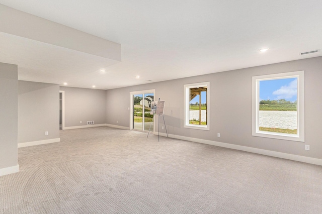 10495 Poppy Ln, Allendale, MI 49401 - unfurnished room featuring light colored carpet, baseboards, and recessed lighting